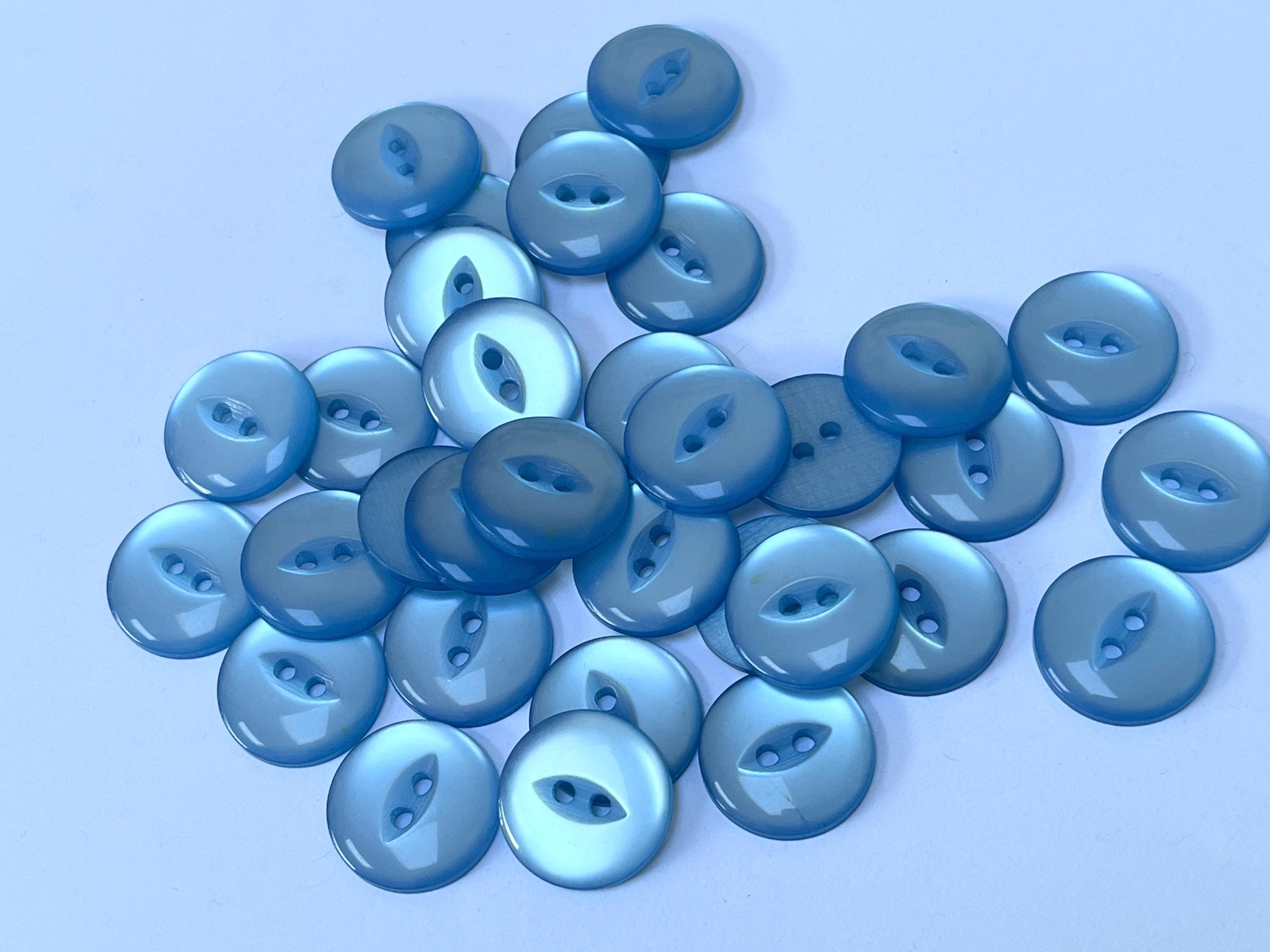 Beauclaire Powder Blue Cats Eye 19mm Buttons on Original Card Beauclaire Powder Blue Cats Eye 19mm Buttons on Original Card