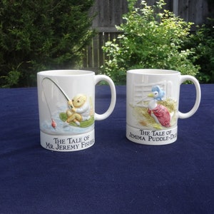 CUPS >  Musical Cups,  1985,  Tales of Mr. Jeremy Fisher,  and Jemina Puddle-Duck,  Beatrix Potter,    "Over the Rainbow",  Schmid,  Japan