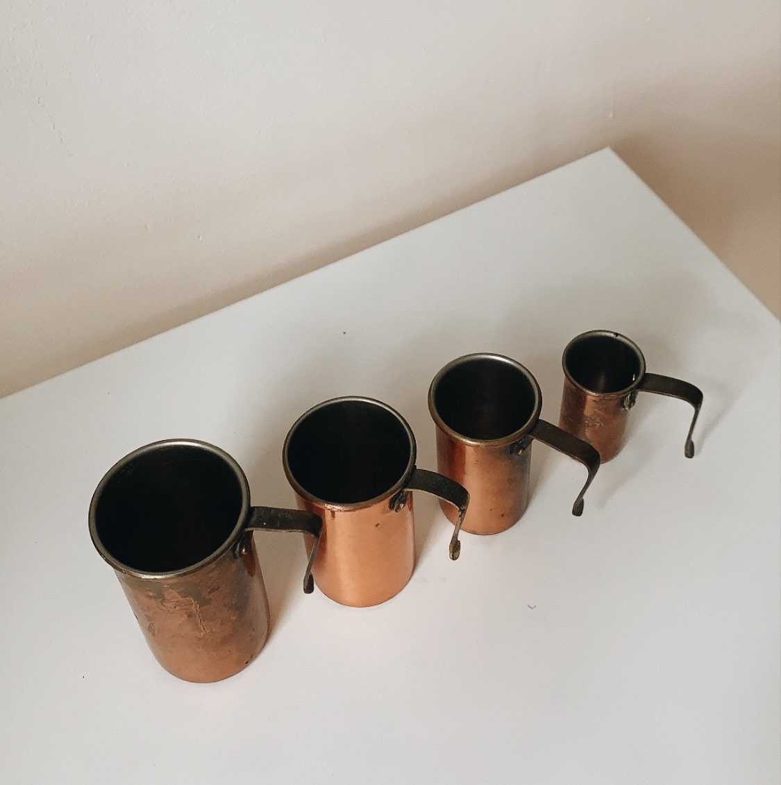 Vintage copper and brass measuring cups $29.95 #Magnoliaandwillowtw