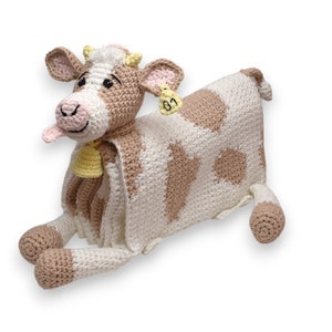 Crochet cow baby blanket that folds into crochet toy cow. PDF crochet pattern to make a cow blanket as baby shower gift. Crochet pattern to make a blanket for babies, children, teens and adults.