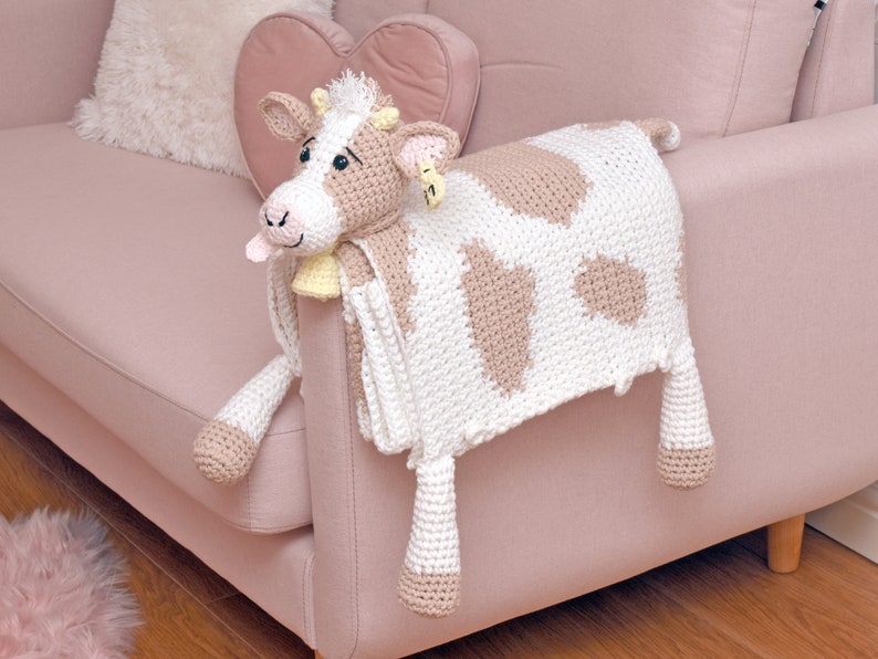 Crochet cow baby blanket that folds into crochet toy cow. PDF crochet pattern to make a cow blanket as baby shower gift. Crochet pattern to make a blanket for babies, children, teens and adults.