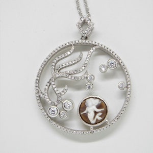 Under the sea pendant encrusted with cz sterling and has a hand carved cameo by Carla