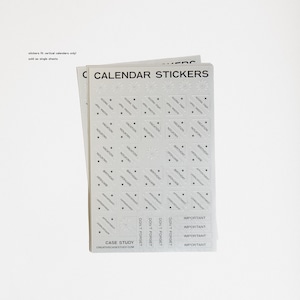 May include: A stack of white calendar sticker sheets. Each sheet has a header that reads "CALENDAR STICKERS". The stickers are in a variety of shapes and sizes, with text labels such as "VACATION", "BIRTHDAY", and "IMPORTANT". The text "CASE STUDY CREATIVECASESTUDY.COM" is also visible.