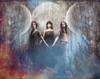 May include: Three women stand in a forest setting, with three large, white, circular shapes behind them. The women are wearing long dresses and have their hands clasped together. The background is a blurred image of trees and foliage.