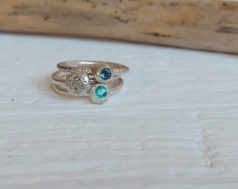 set of three rings in shades of aqua. Emerald ring and aquamarine, sterling silver, set of  blue and green gems