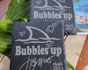 Set of 2 "Bubbles up" coasters w/ Jimmy's signature etched. This is the latest song by Jimmy Buffett.  Parrotheads