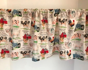 May include: A white valance with a farm theme. The valance features a repeating pattern of red barns, cows, pigs, chickens, and eggs. The text "Go Organic" and "Dairy Farm Artisan Produce" is repeated throughout the valance.