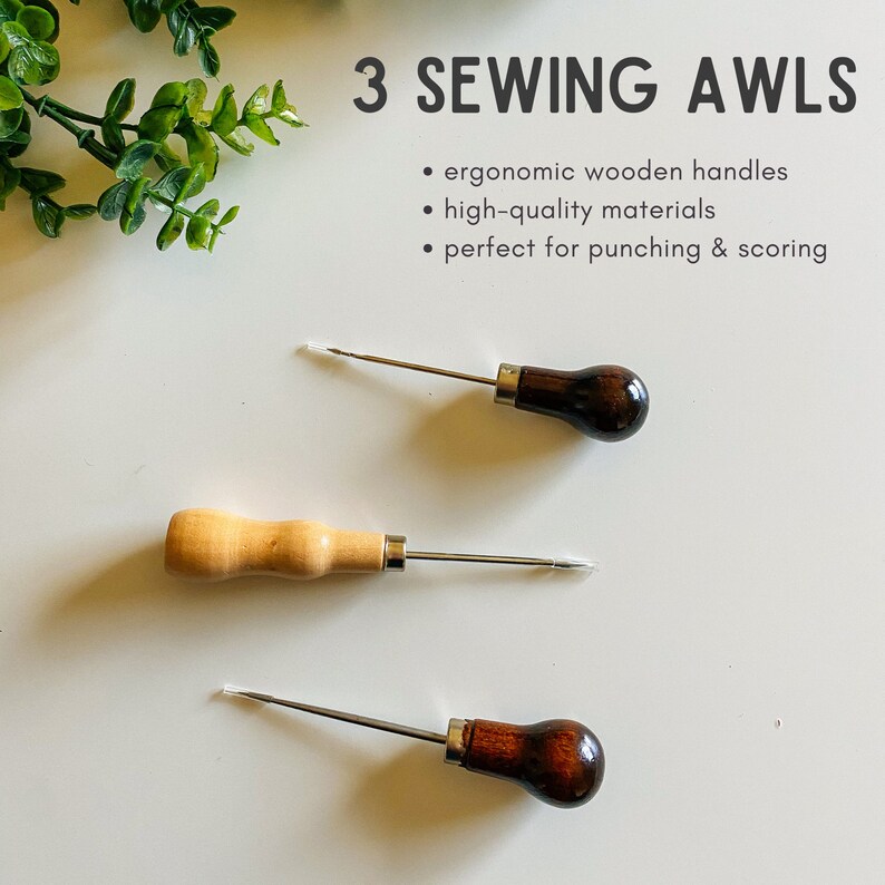 May include: Three wooden handled sewing awls with metal tips. The awls are on a white surface.  "3 Sewing Awls"  "ergonomic wooden handles"  "high-quality materials"  "perfect for punching & scoring"
