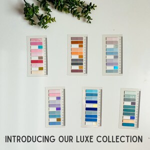 May include: A set of ten colorful washi tape rolls with different patterns and colors. The washi tape is arranged in a grid pattern on a white background. The washi tape is perfect for adding a touch of color and personality to your planner, journal, or scrapbook.