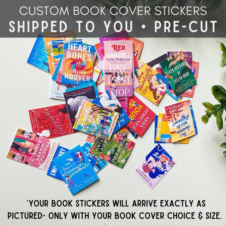 May include: A collection of pre-cut book cover stickers featuring popular book titles. The stickers are arranged on a white surface and include titles such as "Heart Bones", "Red, White & Royal Blue", "The Seven Husbands of Evelyn Hugo", and "The American Roommate Experiment".