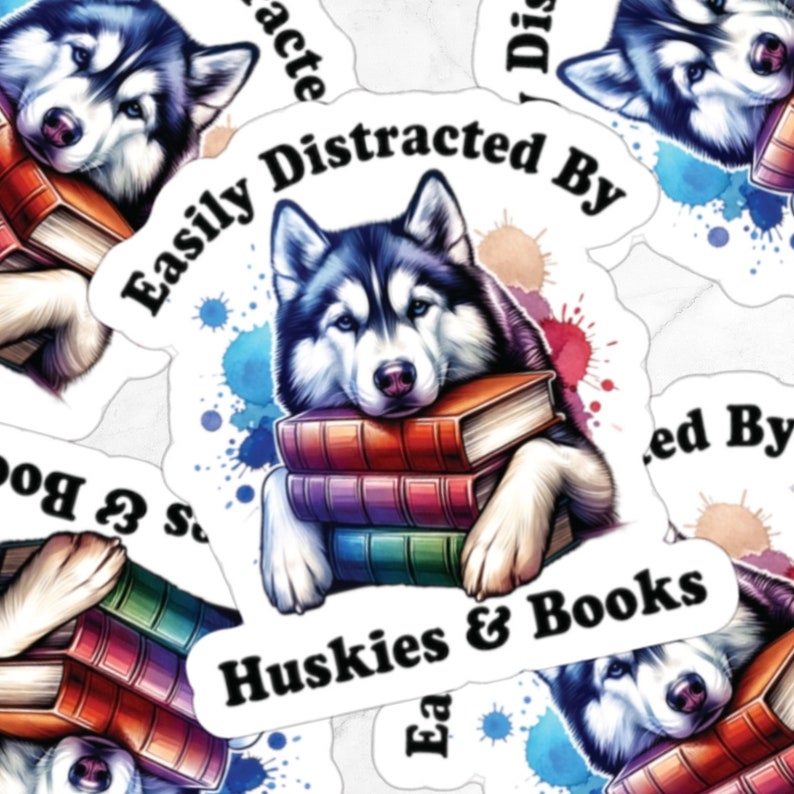 May include: A sticker featuring a cartoon husky with blue eyes, resting its head on a stack of colorful books. The sticker has the text "Easily Distracted By Huskies & Books" and watercolor-style blue and pink splatter paint.
