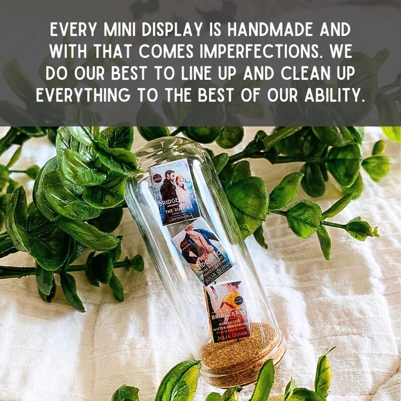 May include: A glass bottle filled with three miniature paperback books. The books are all by Julia Quinn and are part of the Bridgerton series. The bottle has a cork stopper.