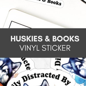 May include: A white vinyl sticker with a watercolor-style background featuring a husky dog with blue eyes, resting its head on a stack of colorful books. The text "Easily Distracted By Huskies & Books" is written in black around the dog and books.