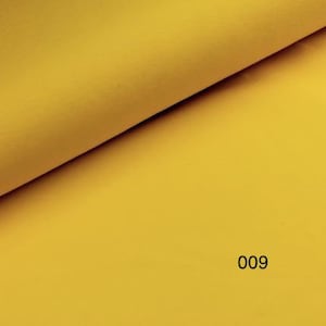 May include: A solid yellow fabric swatch with the number 009 printed on it.
