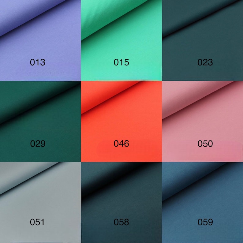 May include: Nine fabric swatches in different colors, including purple, green, teal, red, pink, gray, and blue. Each swatch has a number printed on it, ranging from 013 to 059.