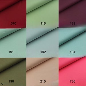 May include: A swatch card with nine fabric samples in various colors, including red, green, purple, blue, beige, and pink. The fabric samples are labeled with numbers: 070, 116, 133, 191, 192, 194, 196, 215, and 736.