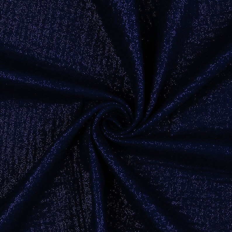 May include: A close-up of a dark blue fabric with a subtle sparkle. The fabric is wrinkled and has a soft, luxurious feel.