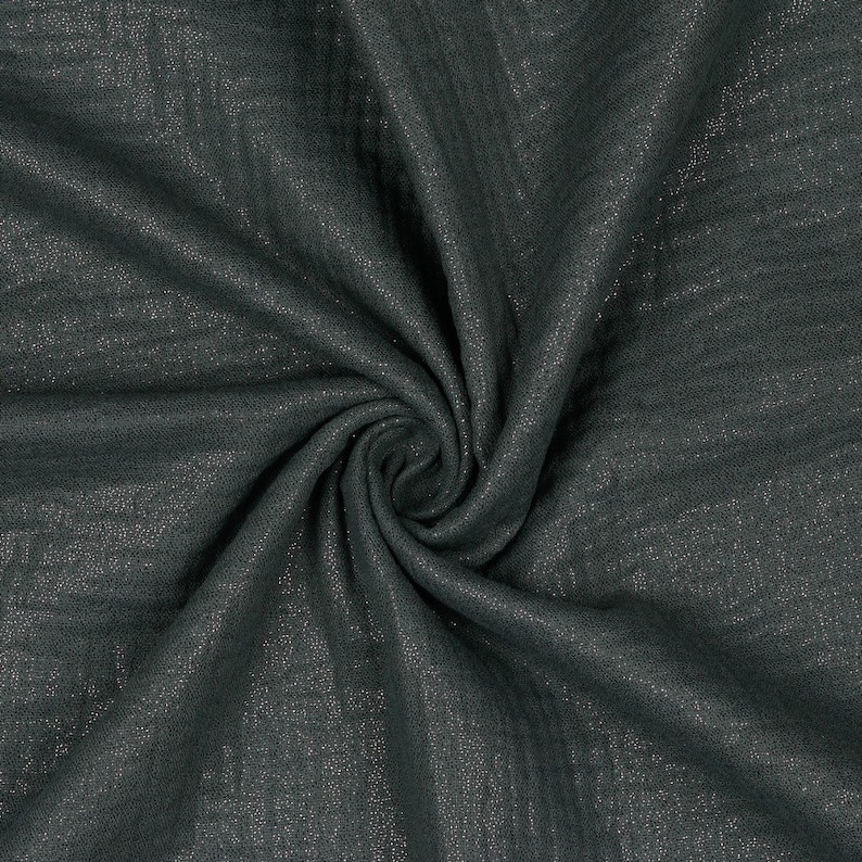 May include: A close-up of a dark gray fabric with a subtle shimmer. The fabric is soft and has a slightly textured surface.