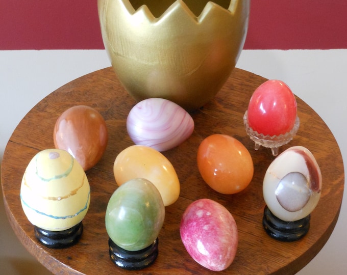 Collection of Nine Eggs in Gold Painted Egg-Shaped Flower Pot