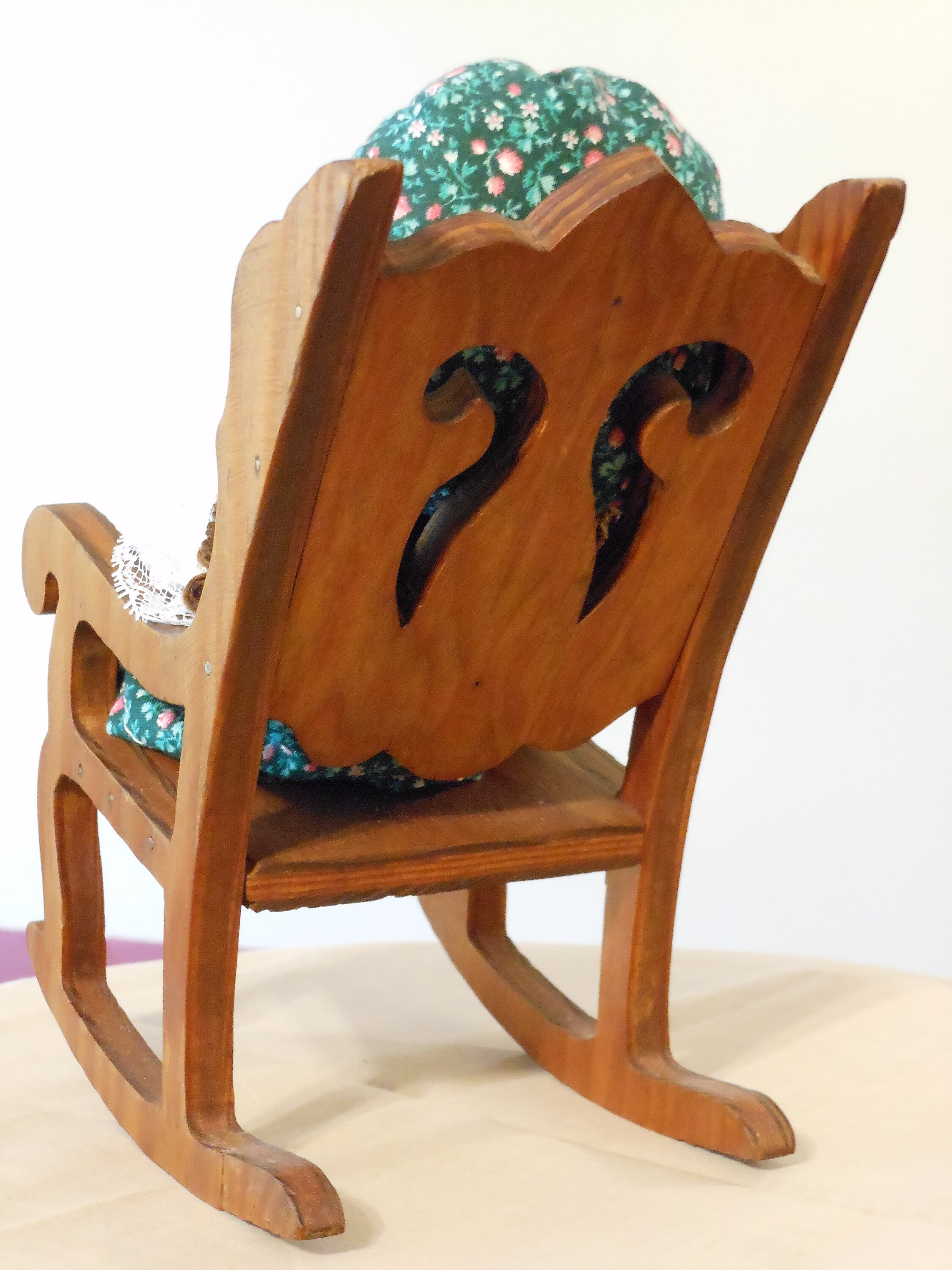 Wooden Doll in Rocking Chair