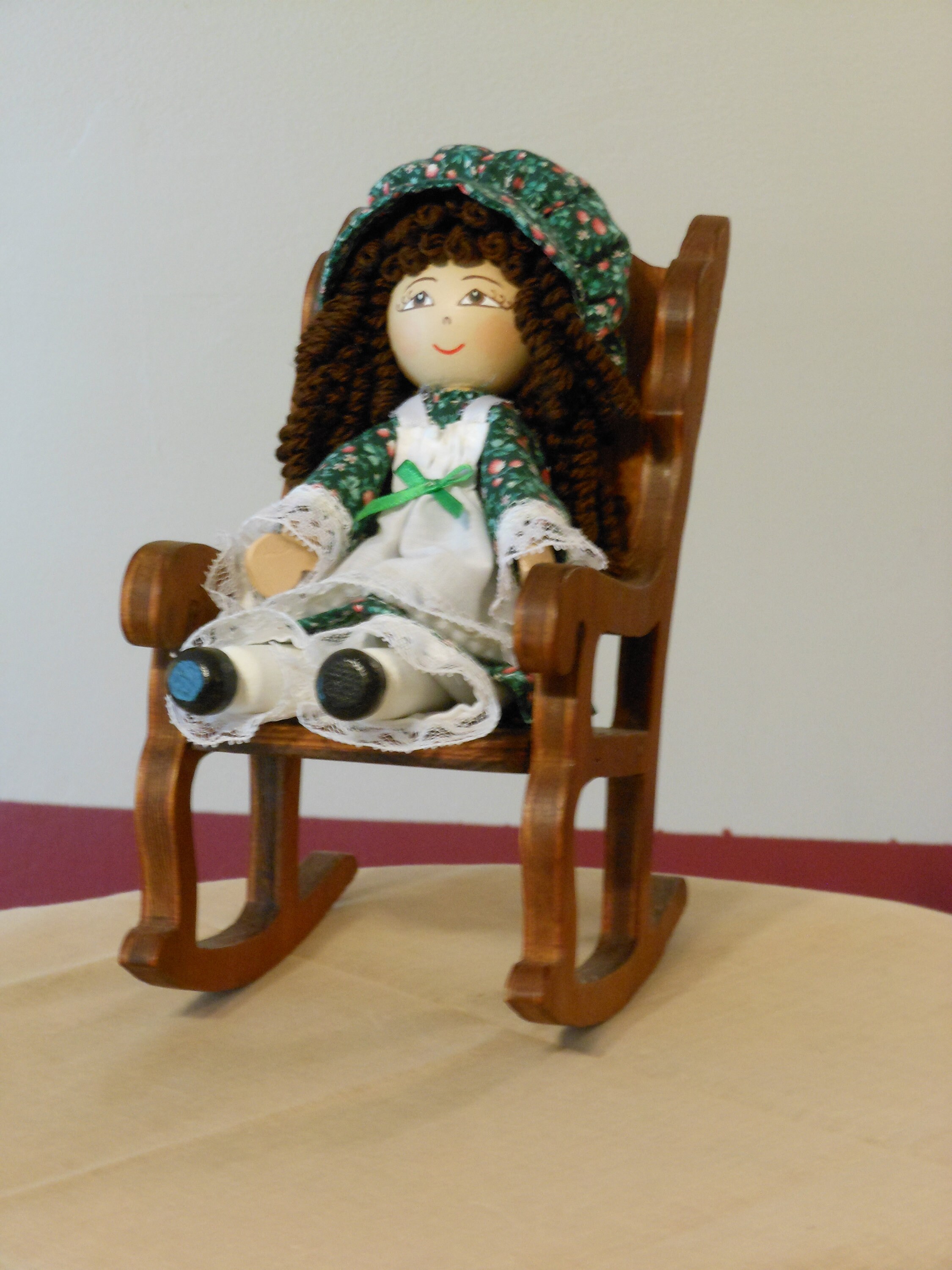 Wooden Doll in Rocking Chair
