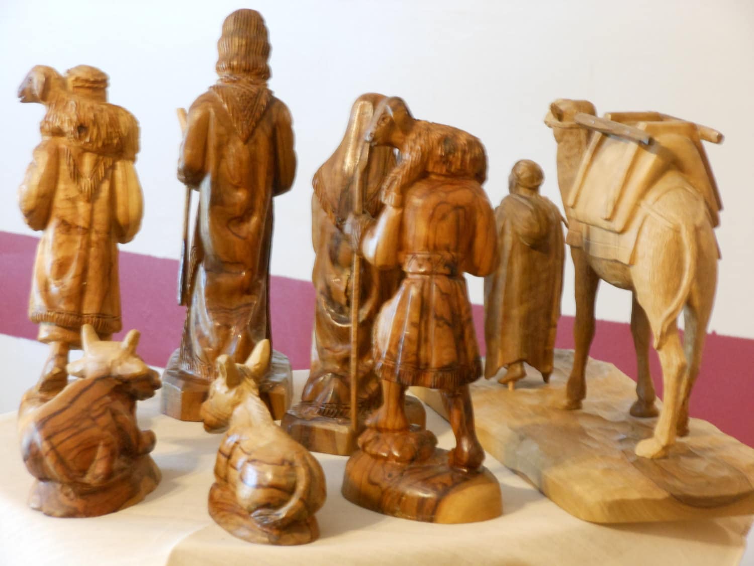 A Collection of Eight Carved Olive Wood Figurines from Israel