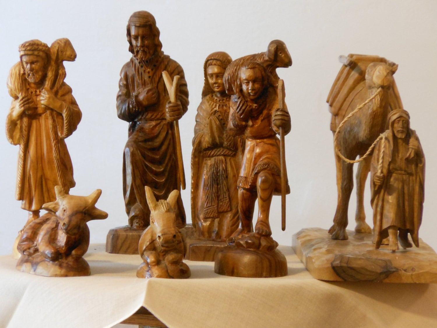 A Collection of Eight Carved Olive Wood Figurines from Israel