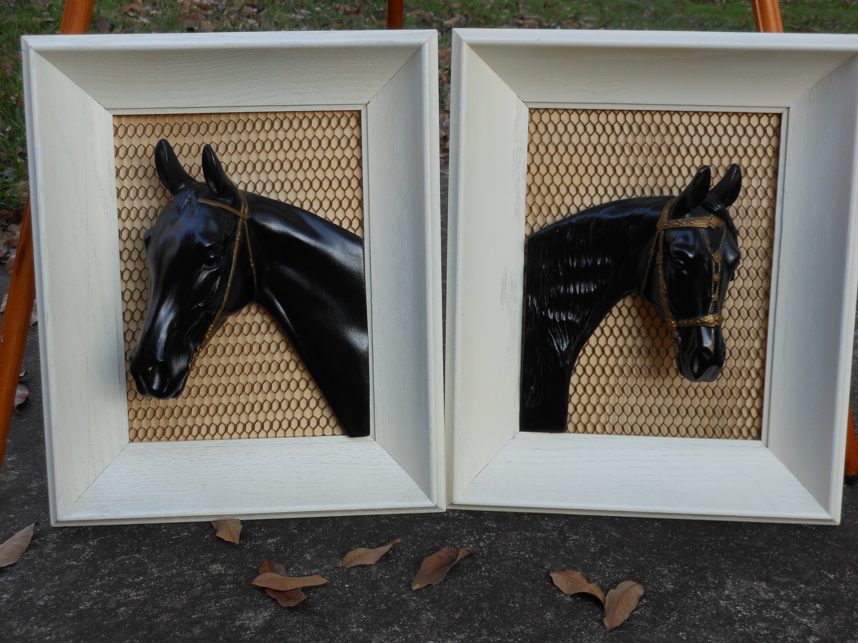 A Pair of Framed 3D Black Resin Horses