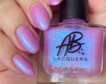 AB Polish Love Potion, Light Pink with a blue shimmer and silver holographic glitter nail polish