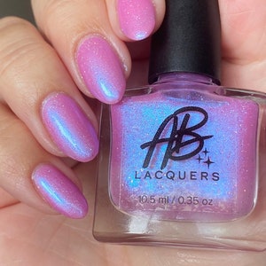 AB Polish Love Potion, Light Pink with a blue shimmer and silver holographic glitter nail polish