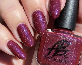 AB Polish Mary, Burgandy with purple shimmer and scattered silver holographic micro shred glitters nail polish