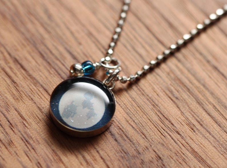 Full moon necklace made from recycled Starbucks gift cards, sterling silver and resin. image 1