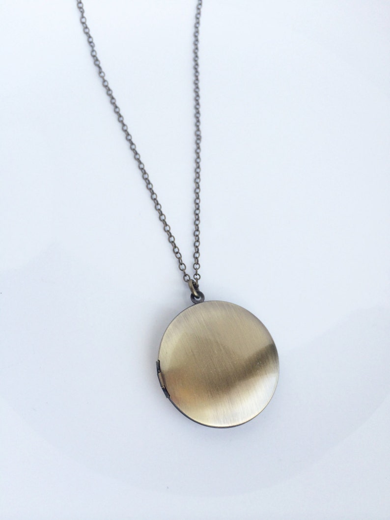 Andromeda \u2022 Round locket necklace