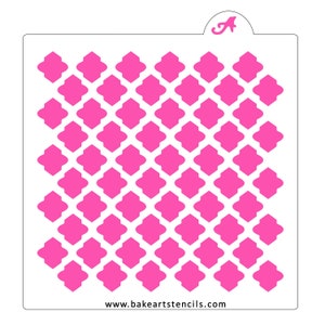 May include: A pink stencil with a repeating geometric pattern of squares and diamonds. The stencil is designed for use with cake decorating and other crafts. The website www.bakeartsstencils.com is printed in the bottom right corner.