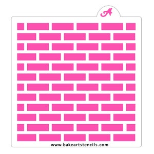 May include: A pink plastic stencil with a brick pattern. The stencil is designed for use with frosting or paint to create a brick wall effect on cakes, cookies, or other baked goods. The stencil is available for purchase from the website www.bakeartstencils.com.