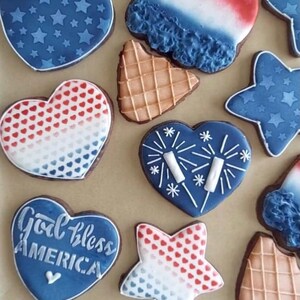 God Bless America stenciled on heart cookies for the 4th of July