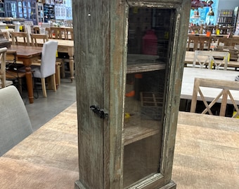 Small vintage-style wall cabinet with an antiqued finish and a glass.