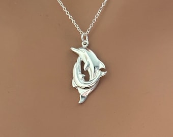 Sterling Silver Dolphins Necklace: Two Playful Dolphins