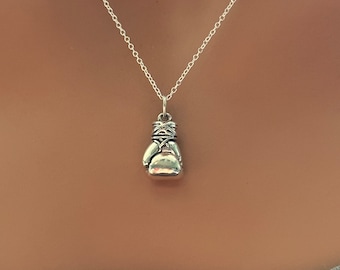 May include: A silver chain necklace with a silver boxing glove pendant.