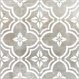 May include: A seamless pattern of white quatrefoil shapes on a light brown background. The quatrefoils are arranged in a repeating pattern, creating a geometric design.