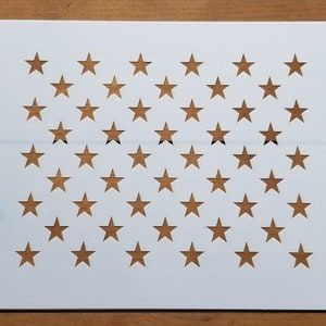 May include: White stencil with 50 stars cut out, for use in crafting projects.