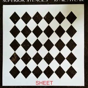 May include: A white vinyl stencil with a checkerboard pattern of black and white diamonds. The stencil is labeled "SUPERIOR STENCILS 10 MIL MYLAR SHEET".