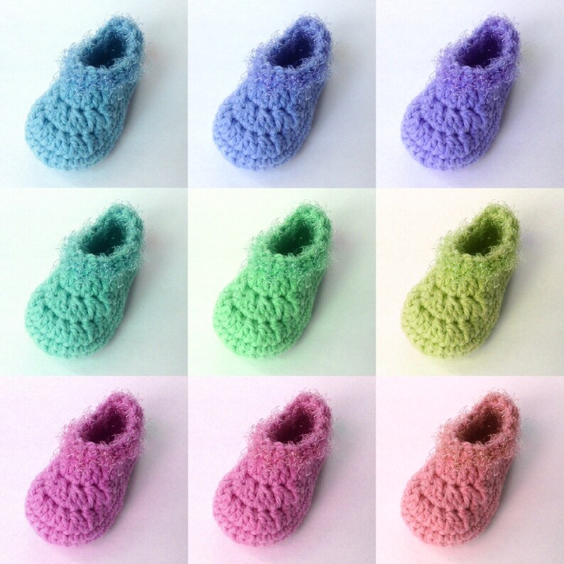May include: Nine pairs of crocheted baby booties in various pastel colors, including light blue, lavender, green, pink, and peach. Each bootie has a fluffy, textured trim around the top.