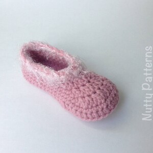 May include: Pink crocheted slipper with a white fuzzy trim around the opening. The slipper is made with a single crochet stitch.