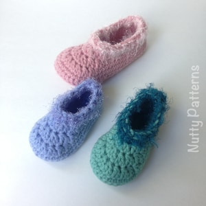 May include: Three pairs of crocheted baby booties in pink, blue, and green. Each bootie has a fluffy trim around the top.