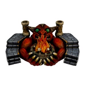 May include: A red demon figurine with green eyes and horns, holding a wooden bowl with a fiery flame and small skulls. The figurine is set within a stone structure with two chimney-like structures on either side.