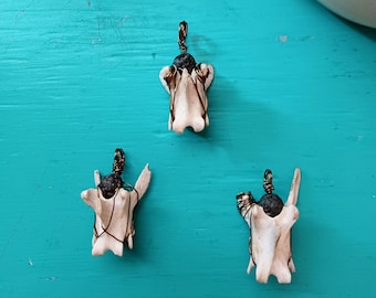 Volcanic Rock Wrapped Vertebrae Pendant