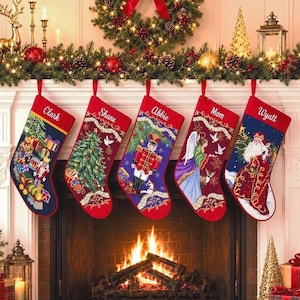 May include: Five personalized Christmas stockings hanging in a row, each featuring unique embroidered designs including a nutcracker, a Christmas tree, an angel, and Santa Claus, with the names Clark, Shane, Abbie, Mom, and Wyatt stitched in white.
