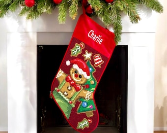 May include: Red velvet Christmas stocking with a gingerbread man design and the name "Charlie" embroidered on the front.