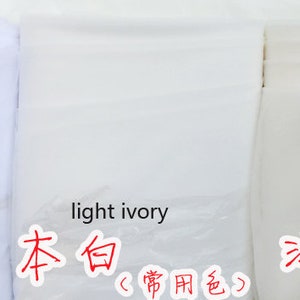May include: Three white fabric swatches labeled "pure white", "light ivory", and "ivory".